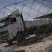 Humanitarian aid begins crossing into Gaza Strip