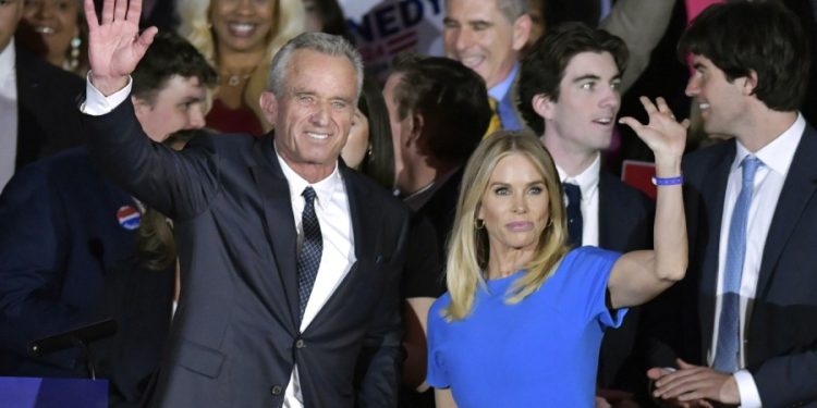Cheryl Hines sells products with naked RFK Jr. showering behind her